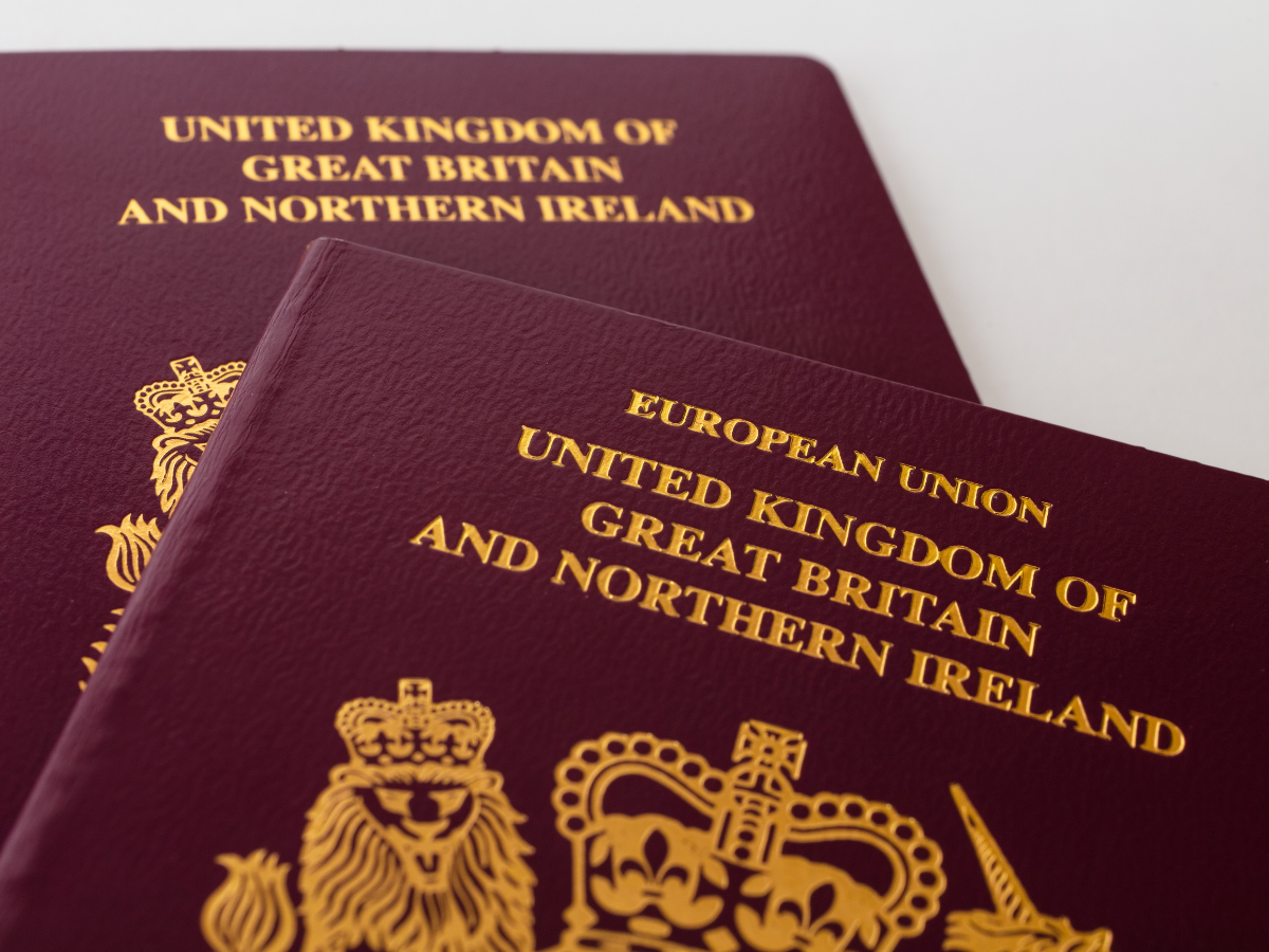 Current and former UK passports showing the changes British travellers should understand when checking UK passport rules for Europe